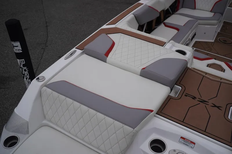 Slide: The Image of 2022 Tigé 22RZX boat interior with stylish seating and RZX branding. - 19