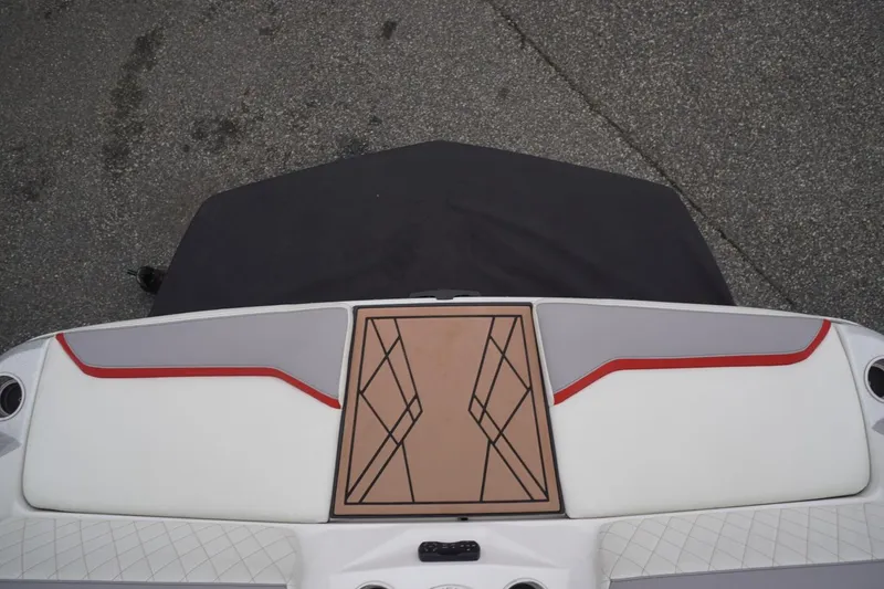 Slide: The Image of 2022 Tigé 22RZX boat interior with stylish red and gray accents. - 22