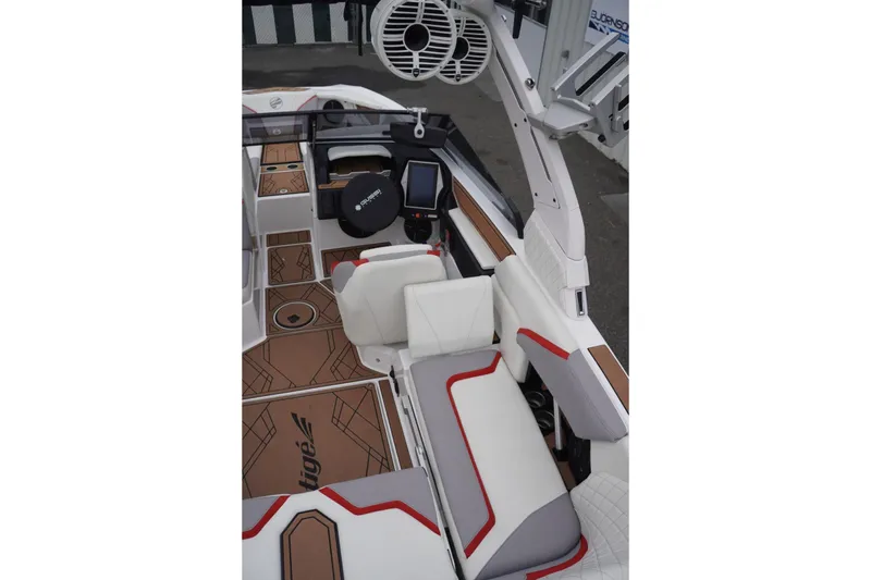 Slide: The Image of 2022 Tigé 22RZX boat interior with modern seating and advanced audio system. - 26