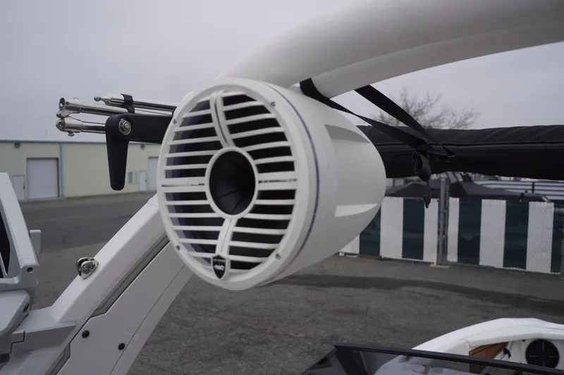 Slide: The Image of 2022 Tigé 22RZX boat with mounted speaker and wakeboard rack. - 29
