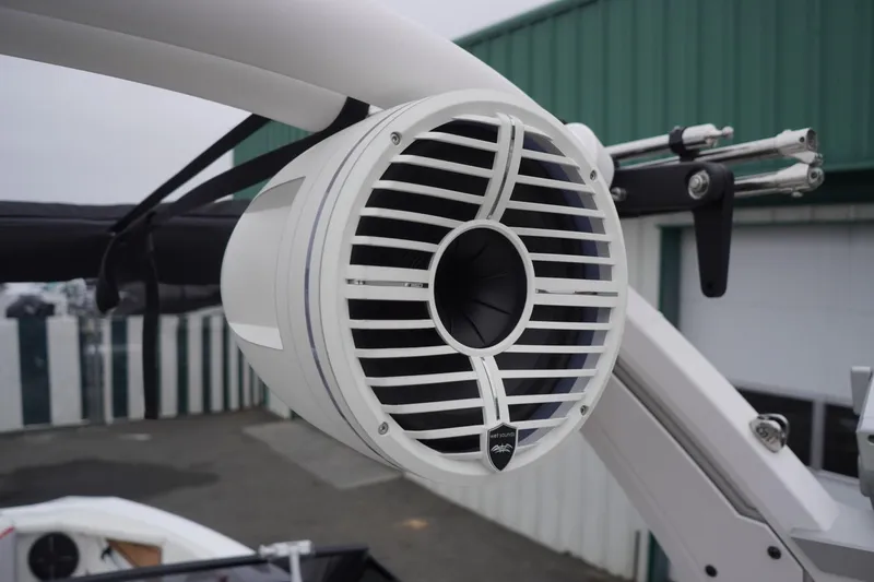 Slide: The Image of 2022 Tigé 22RZX boat speaker with white grille and mounting bracket. - 30