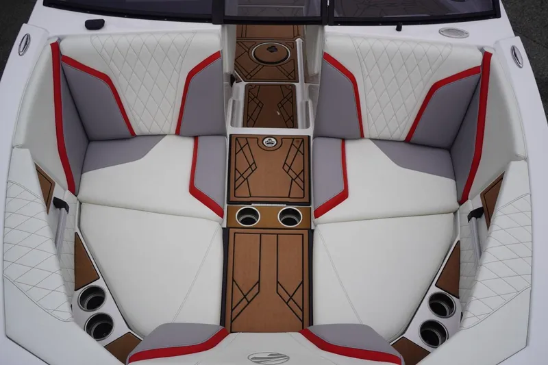 Slide: The Image of 2022 Tigé 22RZX boat interior with white, red, and gray seating, featuring cup holders and stylish design. - 38