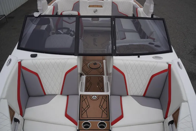 Slide: The Image of 2022 Tigé 22RZX boat interior with white, gray, and red upholstery, featuring a sleek design. - 39