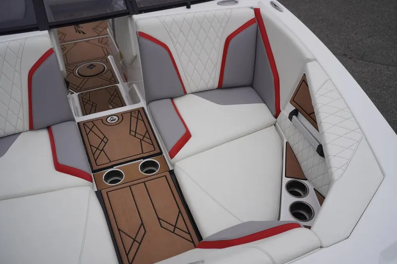 Slide: The Image of Luxurious interior of 2022 Tigé 22RZX boat with white, gray, and red seating. - 43