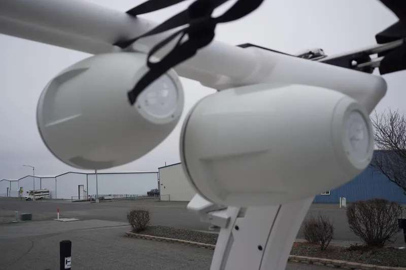 Slide: The Image of 2022 Tigé 22RZX boat speakers in a marina setting. - 45