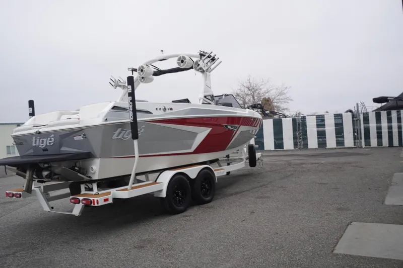Slide: The Image of 2022 Tigé 22RZX boat on trailer, featuring sleek design and modern features. - 72