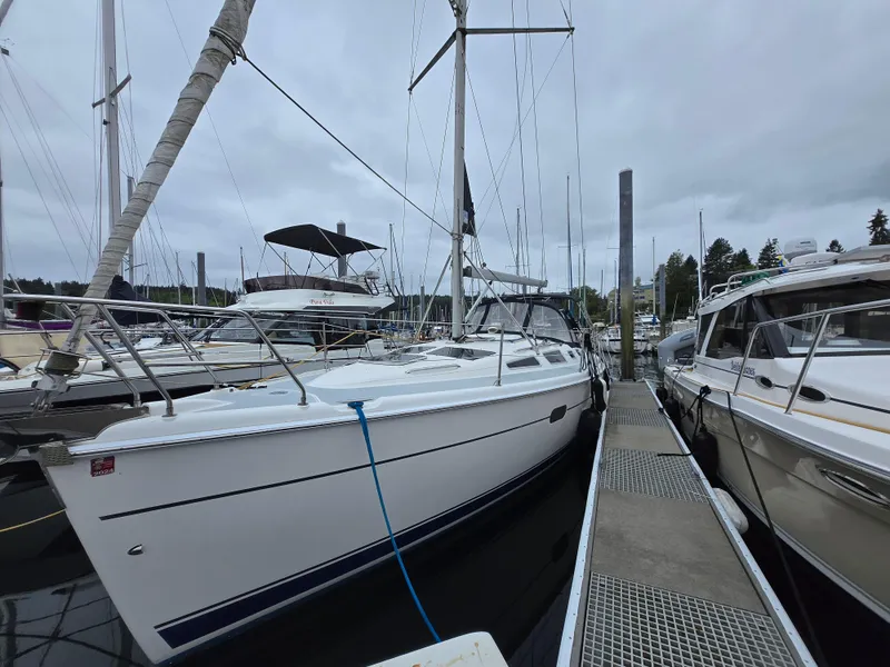The Image of Sailboat docked at marina, Hunter 356 model, 2002, overcast sky. - 0