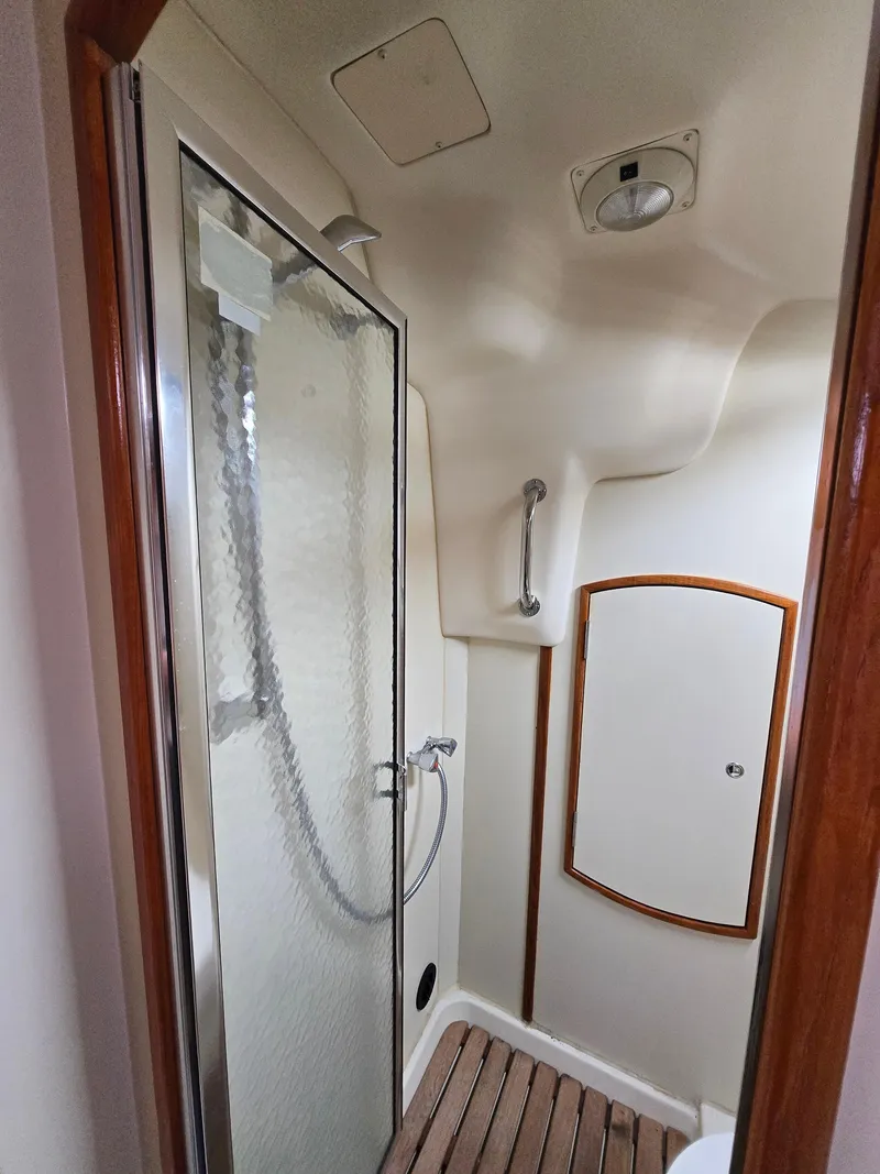 Slide: The Image of Compact bathroom with shower in 2002 Hunter 356 sailboat. - 21