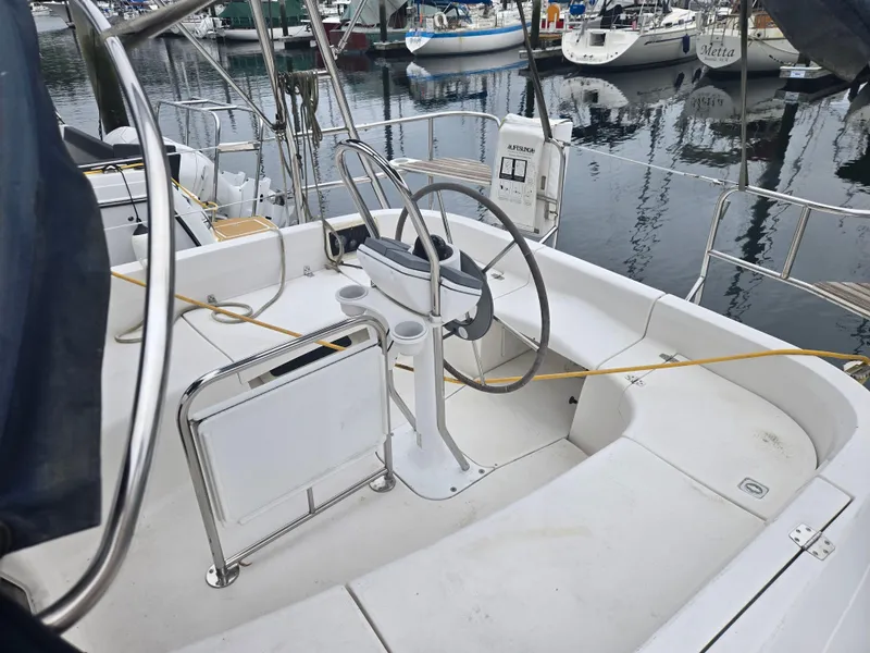Slide: The Image of Cockpit of a 2002 Hunter 356 sailboat docked at a marina. - 3