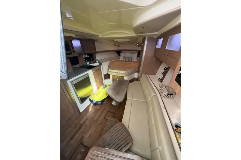 Slide: The Image of Interior of 2012 Boston Whaler 345 Conquest, featuring cozy seating and modern amenities. - 5