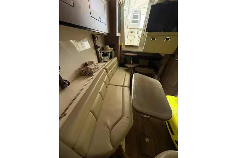 Slide: The Image of Interior of 2012 Boston Whaler 345 Conquest with seating and table. - 8