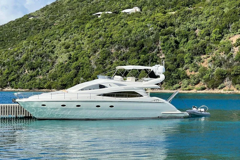 The Image of Luxury 2007 Aicon 56 yacht docked by lush green hillside. - 1