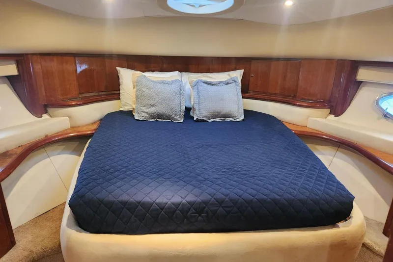 Slide: The Image of Luxurious cabin interior of 2007 Aicon 56 yacht with blue bedding and wooden accents. - 12