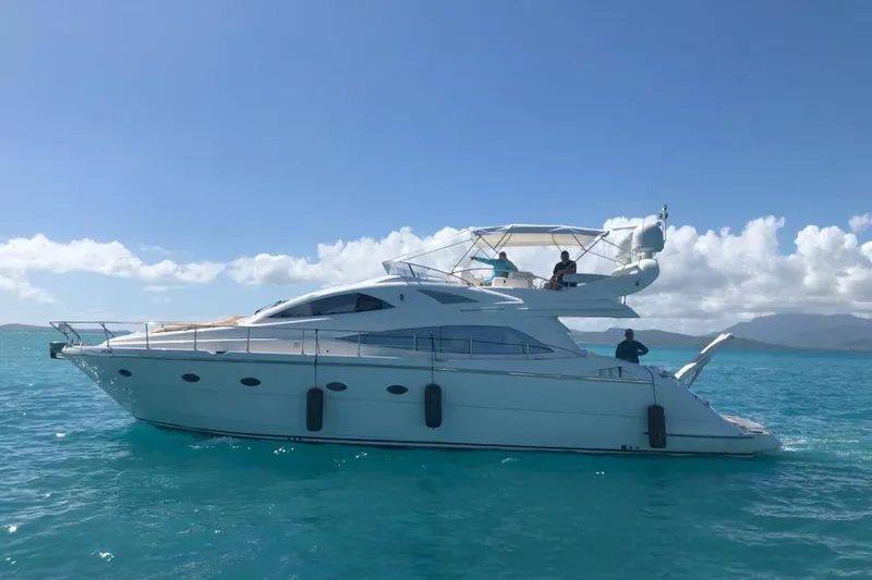 Slide: The Image of Luxury 2007 Aicon 56 yacht cruising on clear blue waters under a sunny sky. - 3