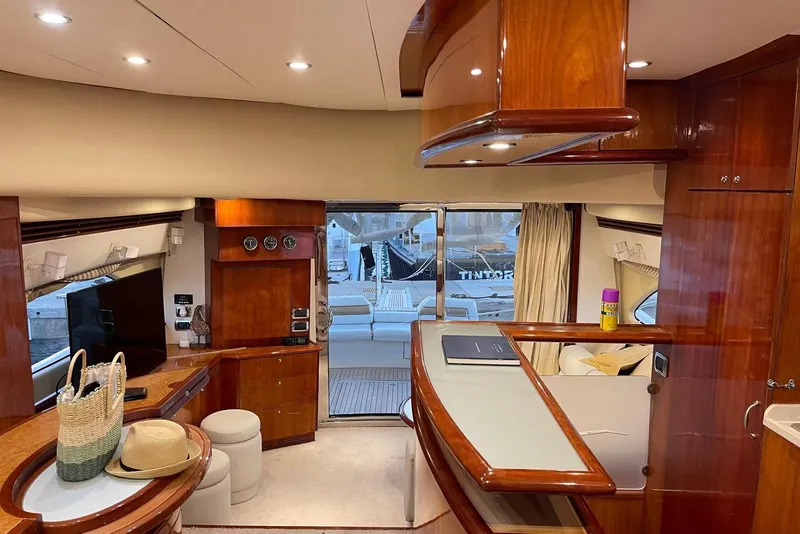 Slide: The Image of Luxurious interior of 2007 Aicon 56 yacht with elegant wood finishes and modern amenities. - 6
