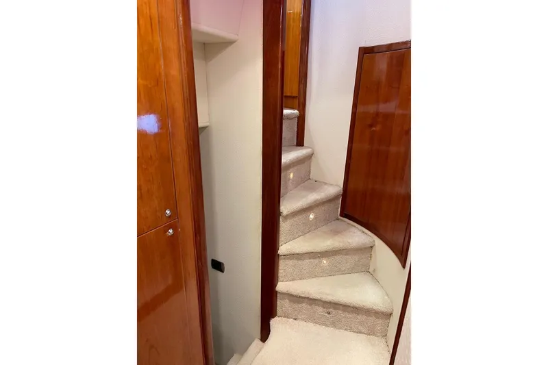 Slide: The Image of Interior staircase of 2007 Aicon 56 yacht with wooden paneling and carpeted steps. - 9