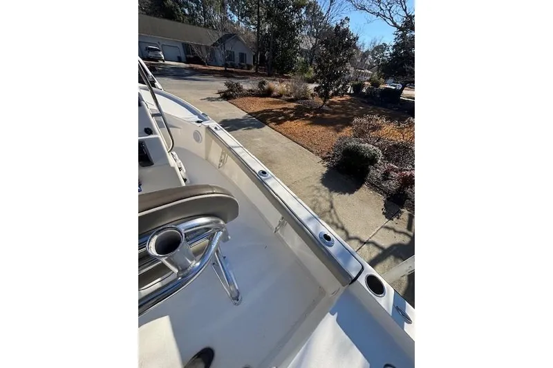 Slide: The Image of 2021 Key West 188 Bay Reef boat with console, parked in driveway. - 15