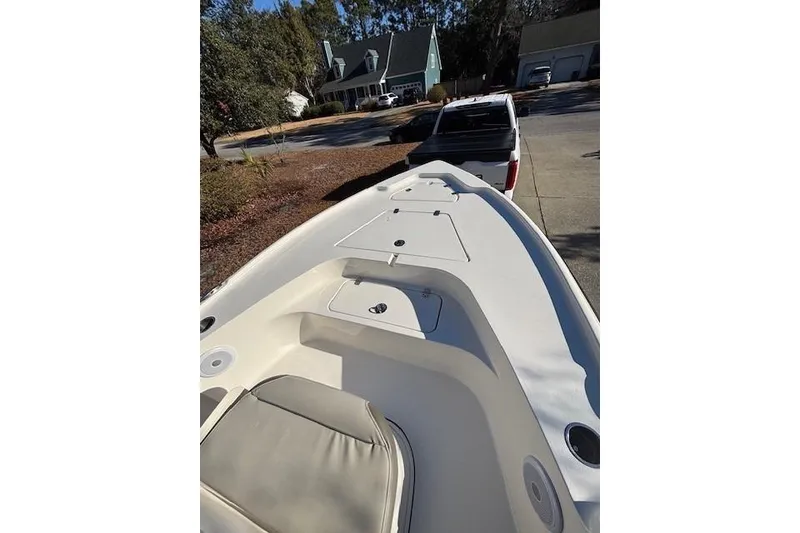 Slide: The Image of 2021 Key West 188 Bay Reef boat interior with seating and storage compartments. - 19