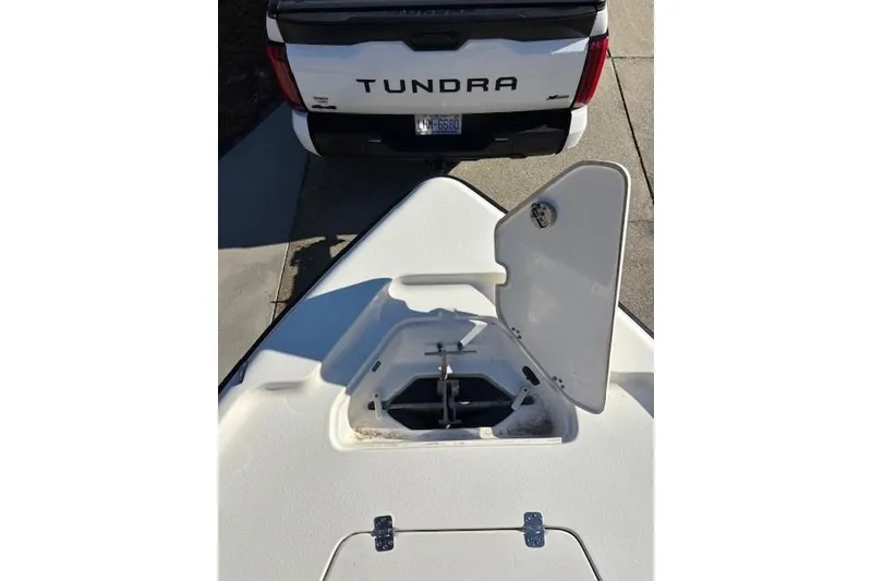 Slide: The Image of 2021 Key West 188 Bay Reef boat with open storage compartment on deck. - 23