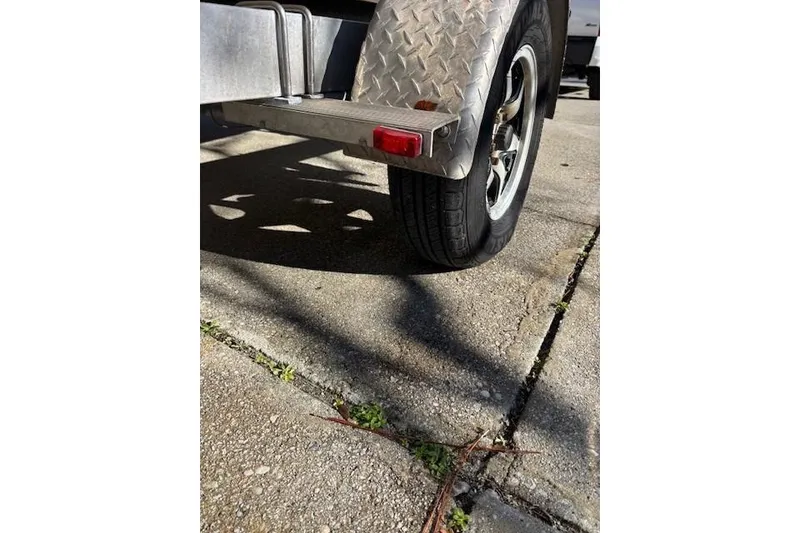 Slide: The Image of 2021 Key West 188 Bay Reef boat engine, detailed view in outdoor setting. - 25