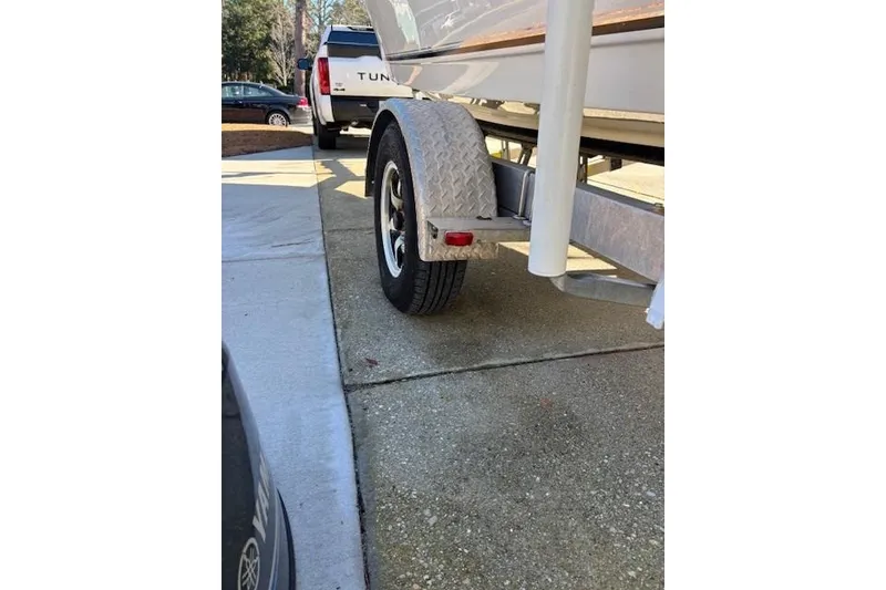 Slide: The Image of 2021 Key West 188 Bay Reef boat on trailer, parked outdoors. - 27