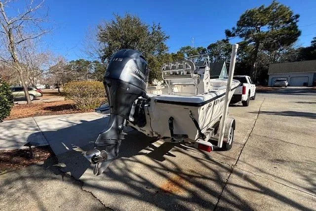 Slide: The Image of 2021 Key West 188 Bay Reef boat with Yamaha outboard motor in driveway. - 5