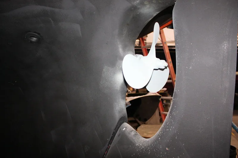 Slide: The Image of Propeller of a 1981 Bristol 40 sailboat in dry dock, showcasing marine engineering. - 11