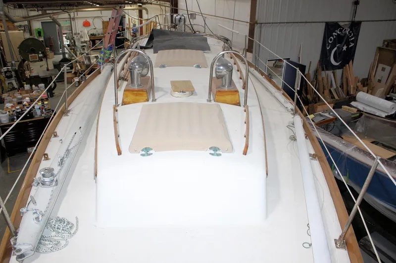 Slide: The Image of 1981 Bristol 40 sailboat deck in a workshop setting. - 13