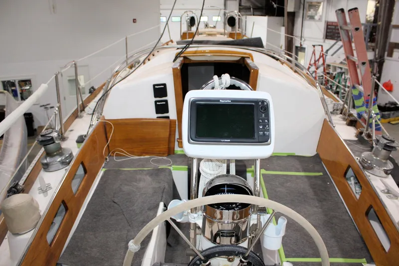 Slide: The Image of 1981 Bristol 40 yacht interior with navigation equipment in a workshop setting. - 23