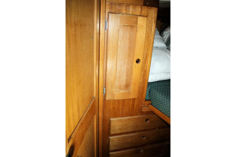 Slide: The Image of Wooden interior of 1981 Bristol 40, featuring storage cabinets and drawers. - 29