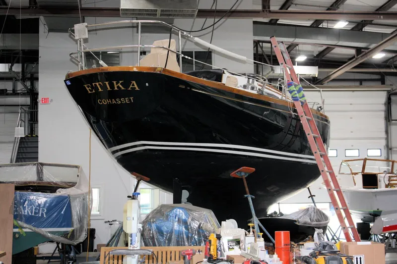 Slide: The Image of Interior of a 1981 Bristol 40 sailboat with wooden cabinetry and nautical equipment. - 44