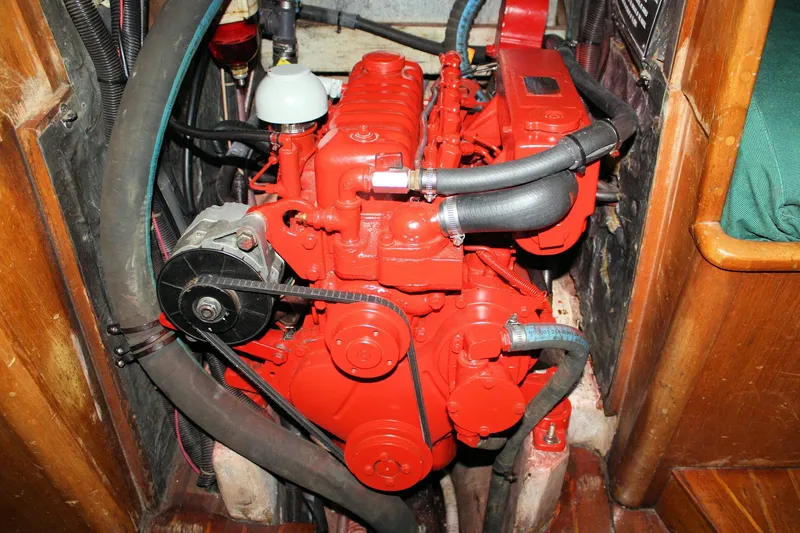 Slide: The Image of 1981 Bristol 40 engine compartment with red engine and hoses. - 53