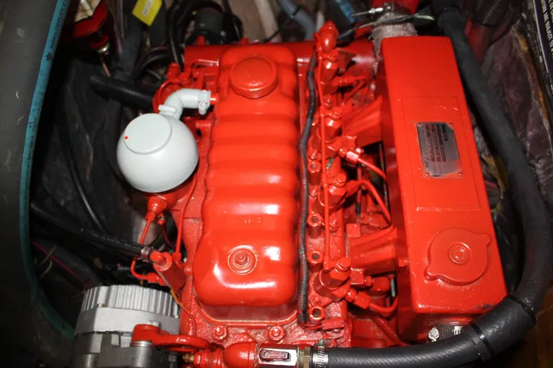 Slide: The Image of Red engine of a 1981 Bristol 40, showcasing detailed mechanical components. - 54