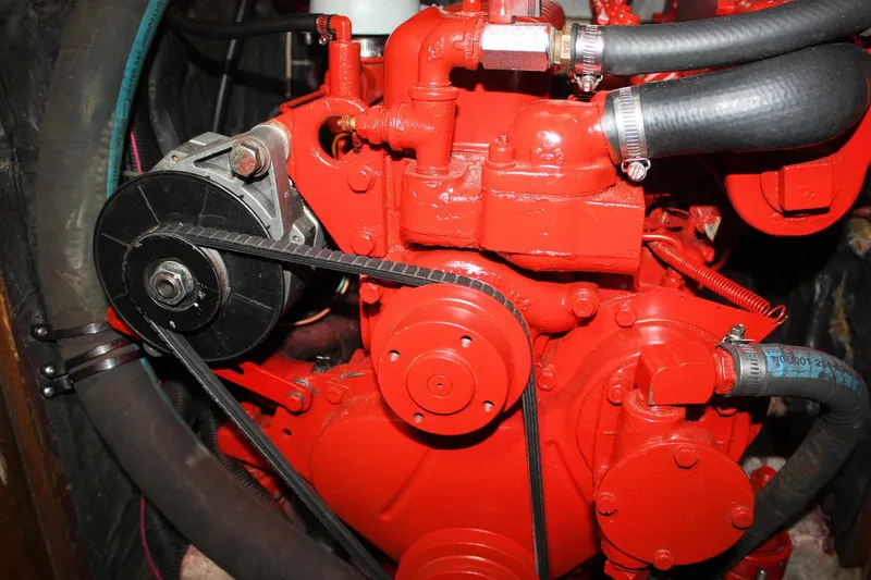 Slide: The Image of Red engine of a 1981 Bristol 40 with visible belts and hoses. - 55