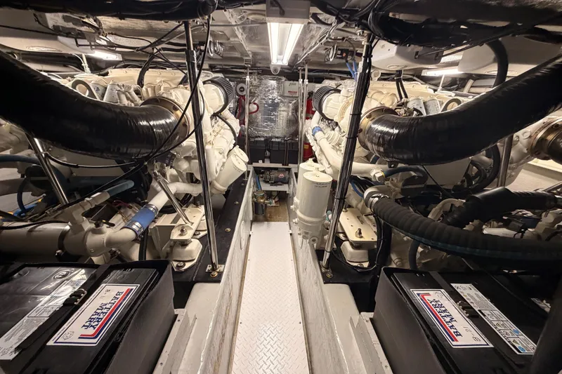 Slide: The Image of Engine room of 1999 Carver 530 Voyager Pilothouse with dual engines and batteries. - 110