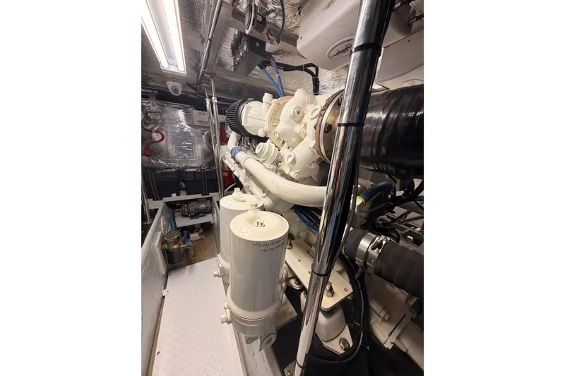 Slide: The Image of Engine room of 1999 Carver 530 Voyager Pilothouse with visible machinery and components. - 113