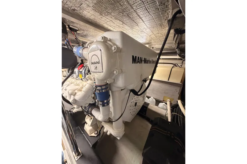 Slide: The Image of Engine room of 1999 Carver 530 Voyager Pilothouse with MAN marine diesel engine. - 121