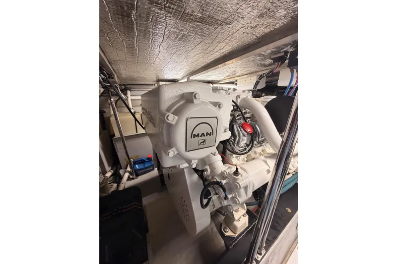 Slide: The Image of Engine room of 1999 Carver 530 Voyager Pilothouse with MAN engine components. - 122