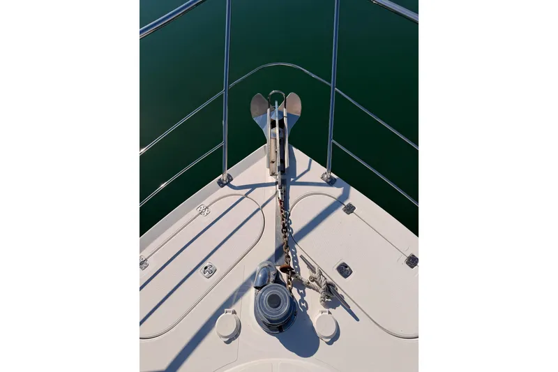 Slide: The Image of Bow of 1999 Carver 530 Voyager Pilothouse with anchor and chain. - 16