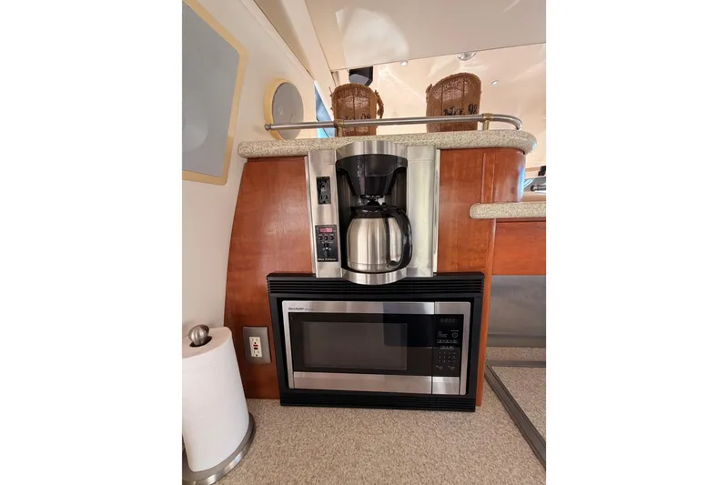 Slide: The Image of Coffee maker and microwave in 1999 Carver 530 Voyager Pilothouse kitchen area. - 33