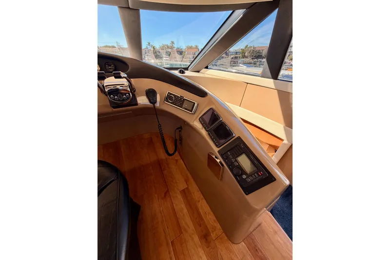 Slide: The Image of 1999 Carver 530 Voyager Pilothouse helm with controls and navigation equipment. - 42