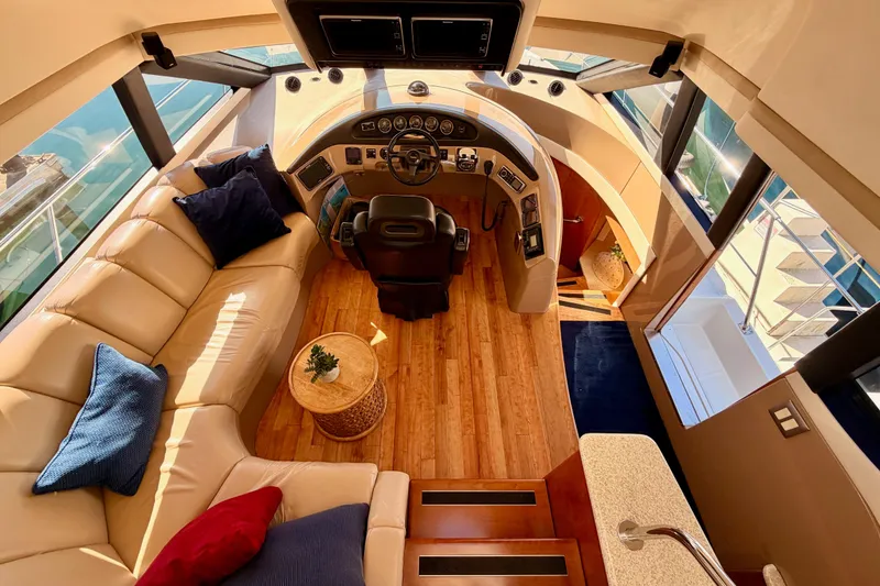 Slide: The Image of Luxurious interior of 1999 Carver 530 Voyager Pilothouse with leather seating and helm. - 70