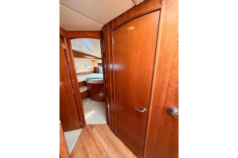 Slide: The Image of Interior of 1999 Carver 530 Voyager Pilothouse with wooden doors and cozy bedroom. - 77