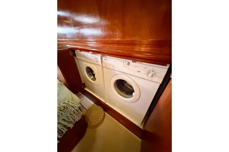 Slide: The Image of Laundry appliances in 1999 Carver 530 Voyager Pilothouse yacht interior. - 91