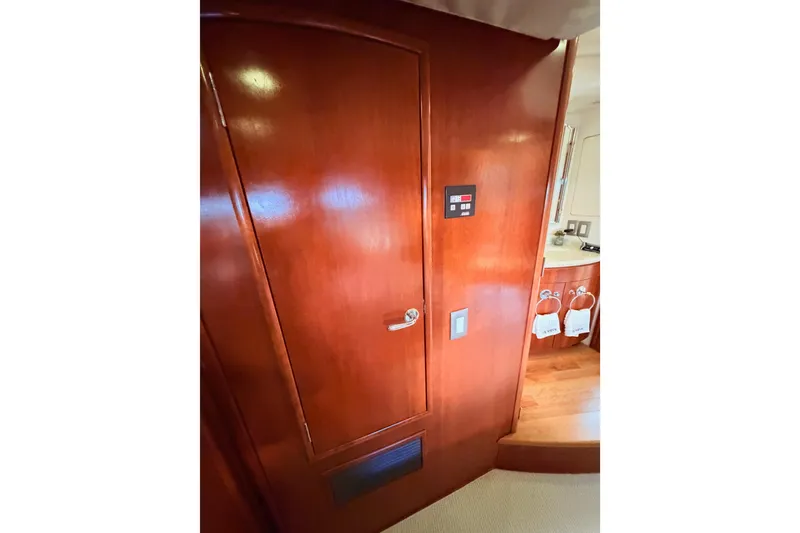 Slide: The Image of Interior of 1999 Carver 530 Voyager Pilothouse with wooden door and control panel. - 93