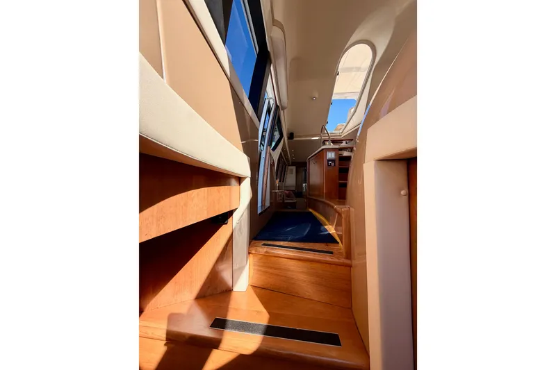 Slide: The Image of Interior view of 1999 Carver 530 Voyager Pilothouse with wooden steps and modern design. - 104