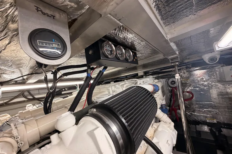 Slide: The Image of Engine room of 1999 Carver 530 Voyager Pilothouse with gauges and wiring. - 116