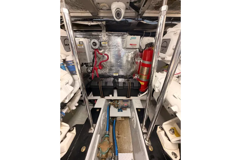 Slide: The Image of Engine room of 1999 Carver 530 Voyager Pilothouse with equipment and fire extinguisher. - 117