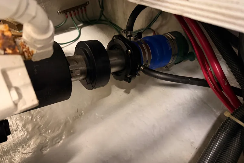 Slide: The Image of Engine compartment of 1999 Carver 530 Voyager Pilothouse with visible mechanical components. - 124