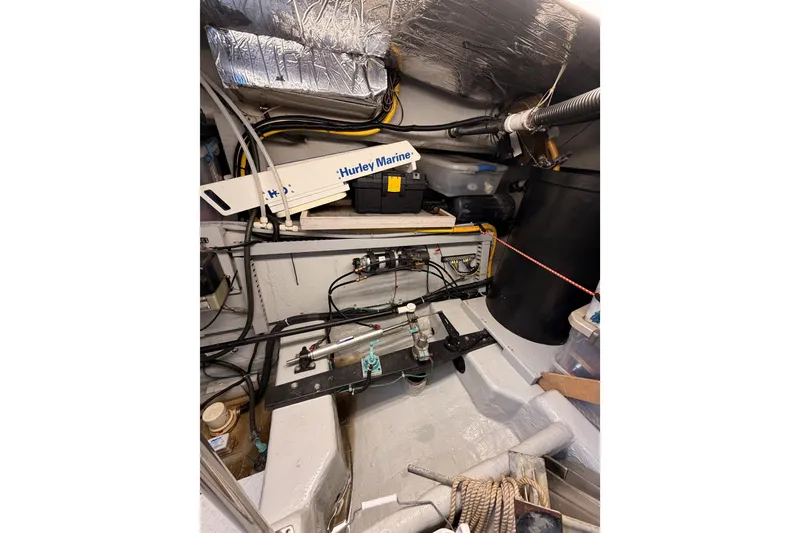 Slide: The Image of Engine room of 1999 Carver 530 Voyager Pilothouse with marine equipment and wiring. - 132